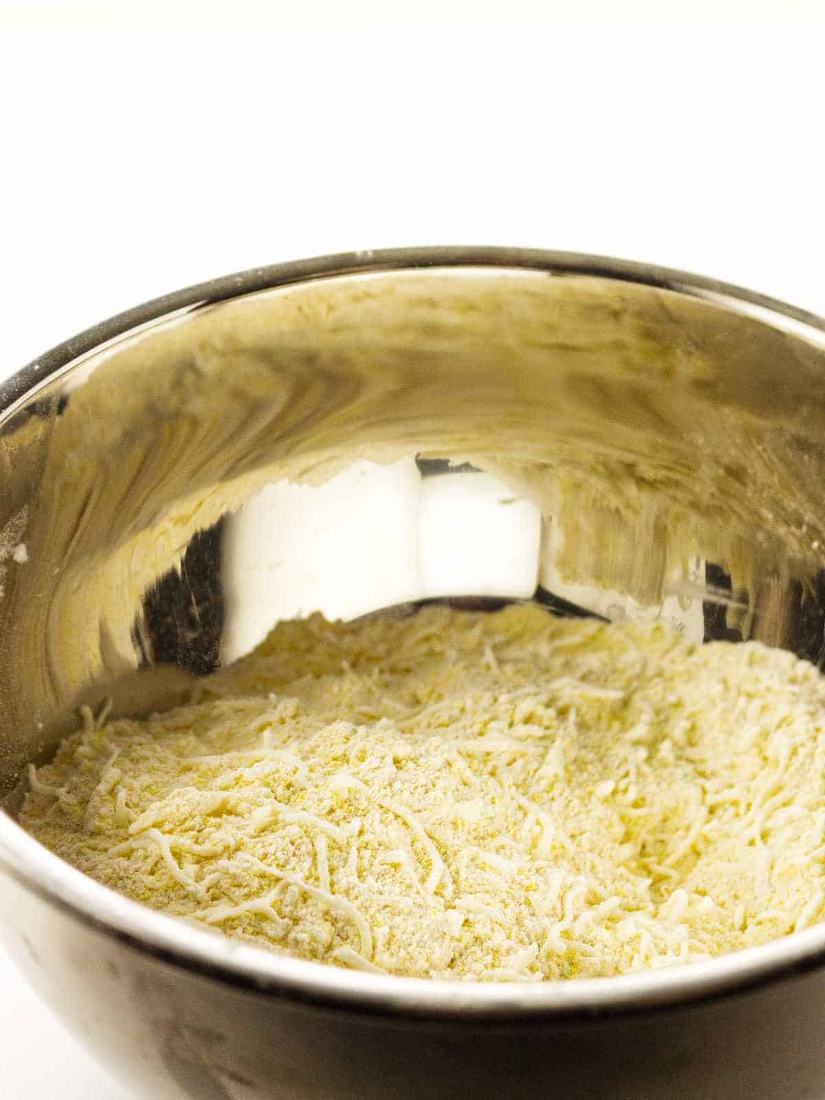 cornmeal mixture tossed with grated cheese.