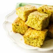 serving platter with squares of Cajun cornbread.