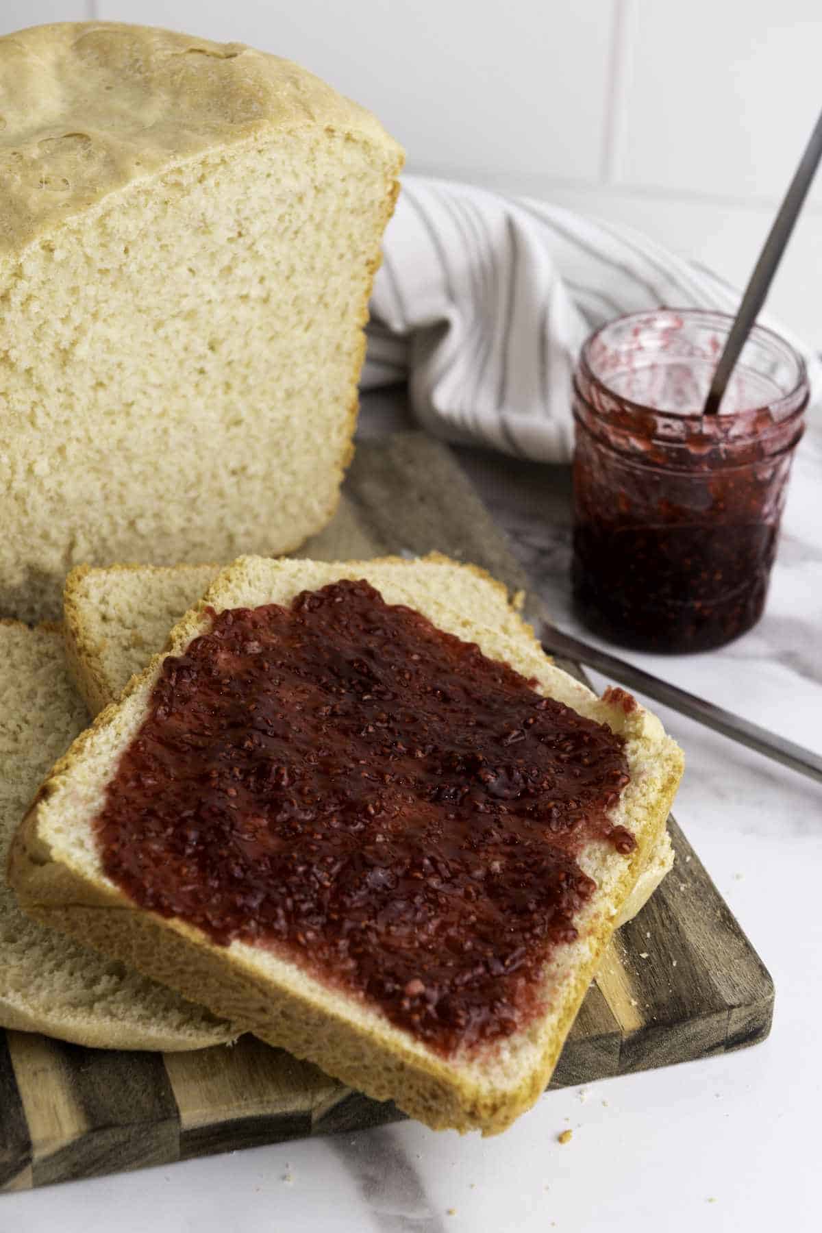 Slices of bread with jam spread on it.