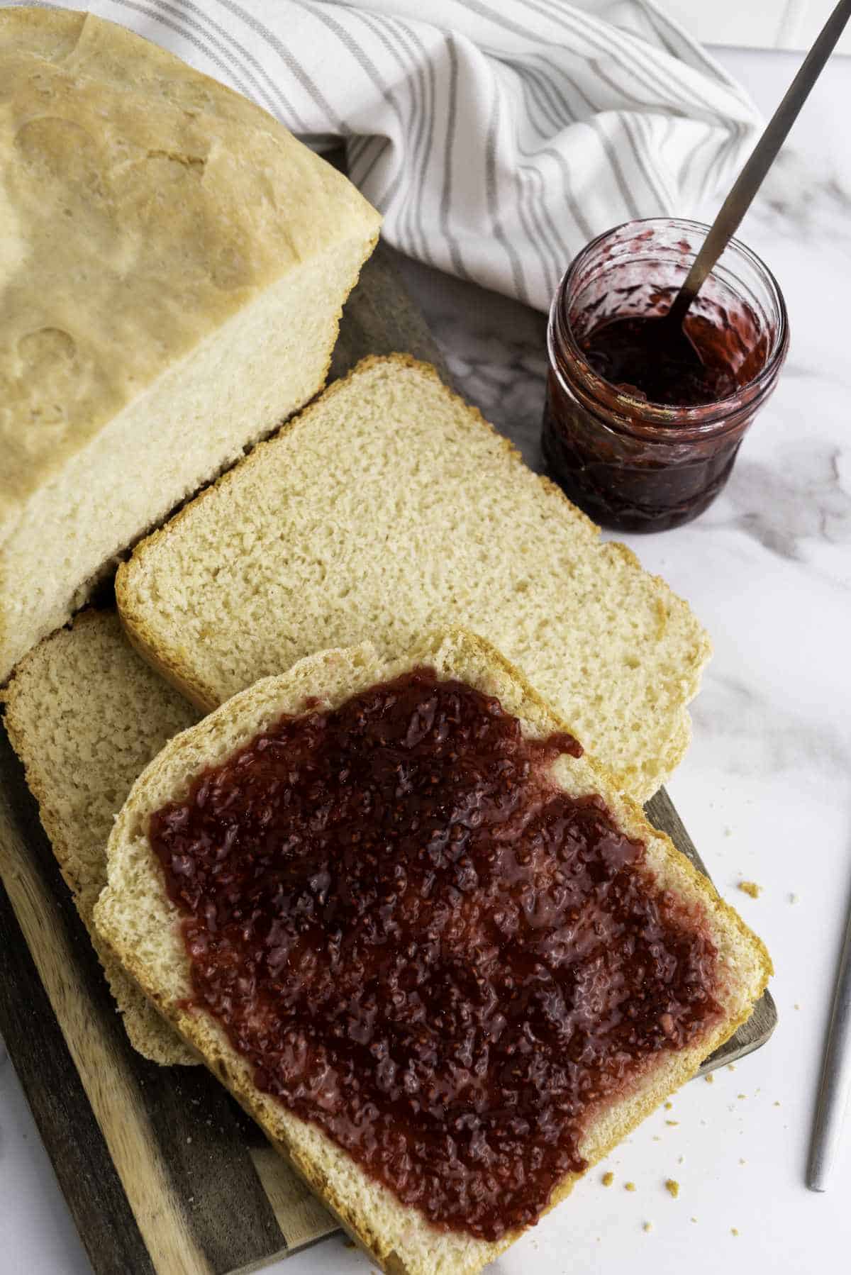 Slices of bread with jam spread on it.