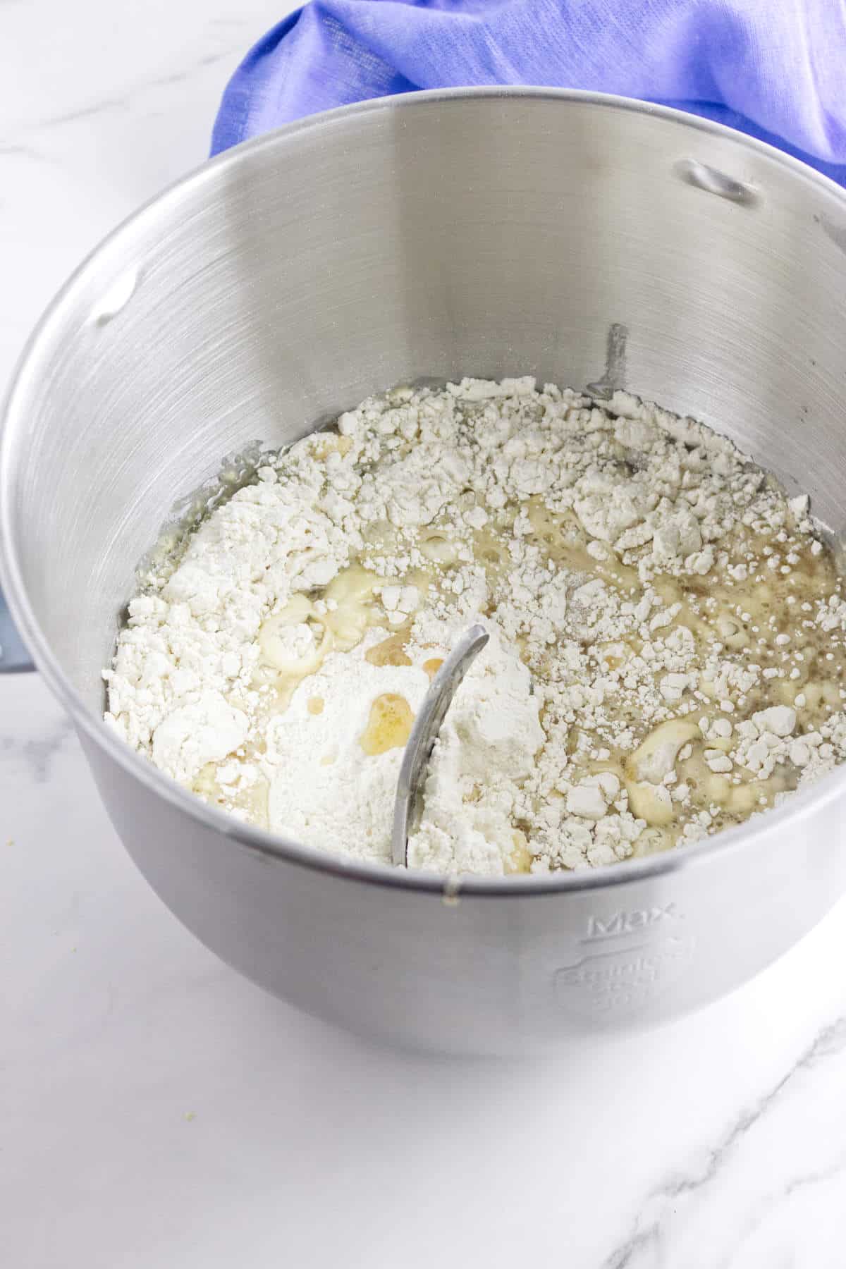 mixing proofed yeast with flour.