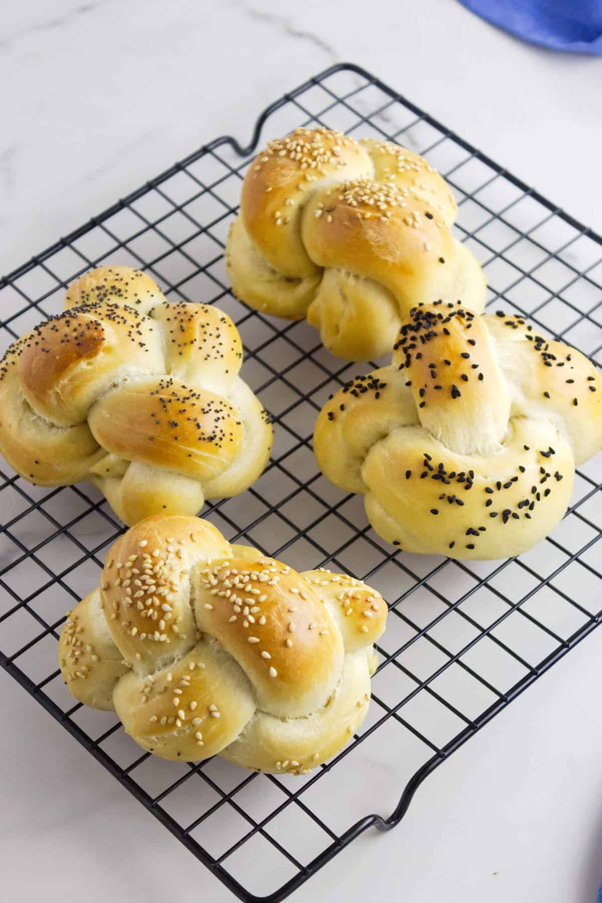 cooling rack with challah rolls.