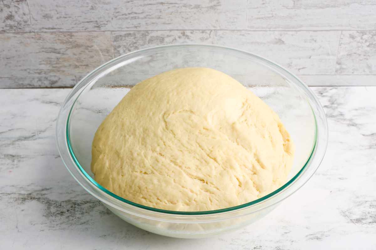 Dough risen in a bowl.