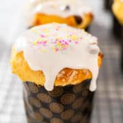 Sprinkles added on top of Easter bread kulich to decorate.