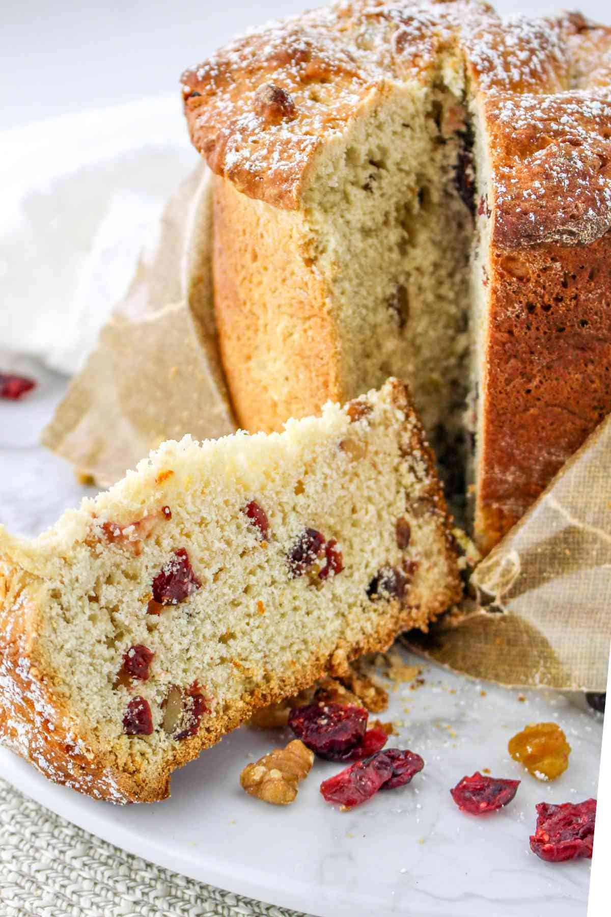 slice cut of Italian Panettone Christmas Cake.