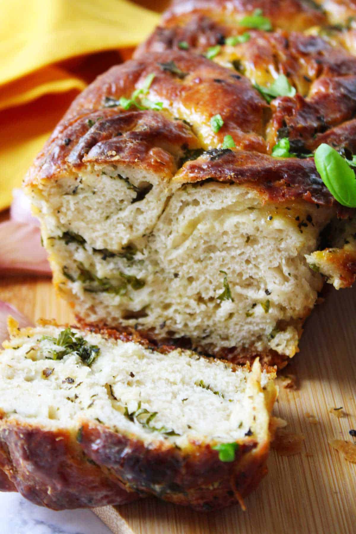 Fresh twisted loaf of garlic and herb bread.