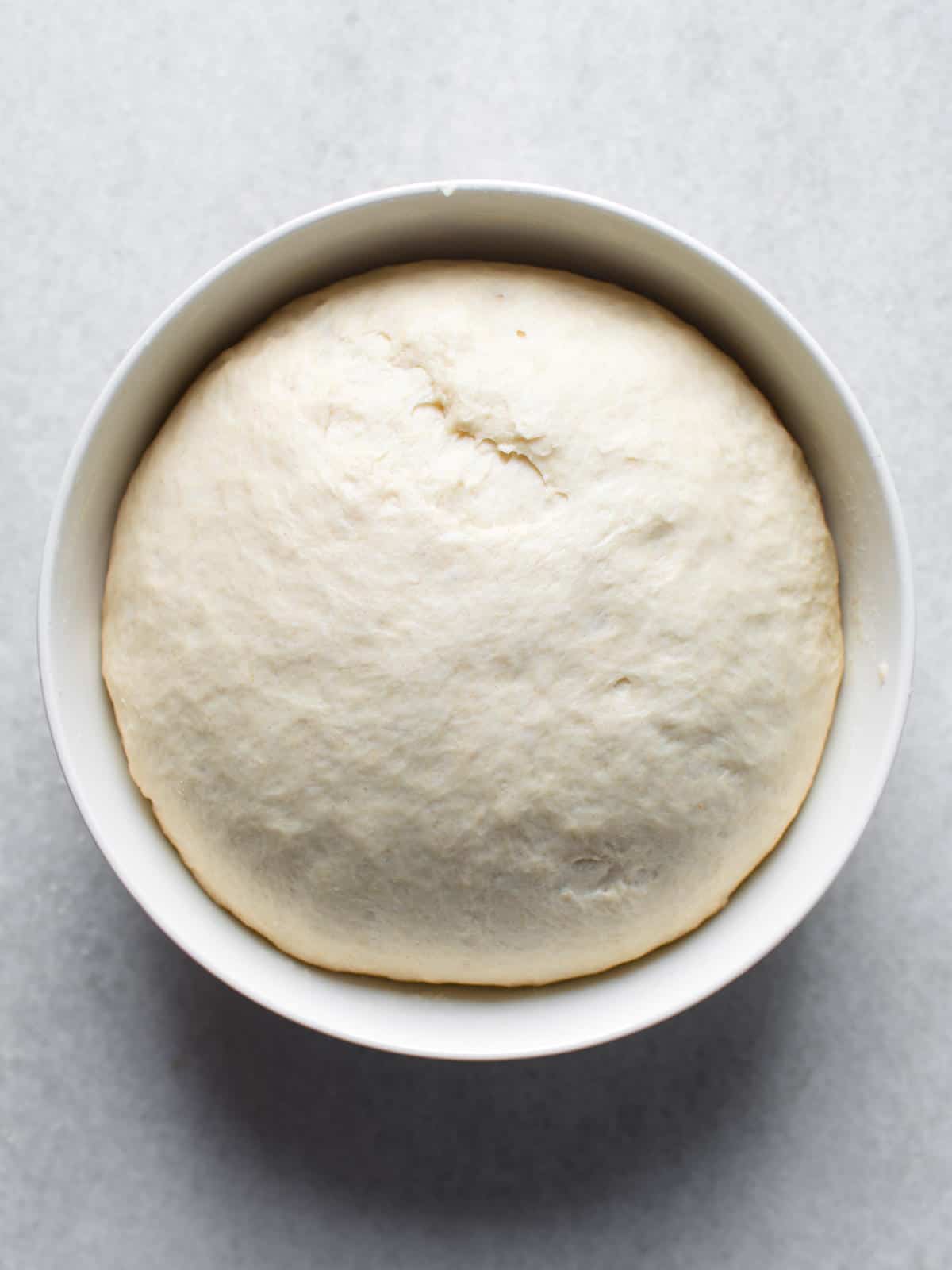 Dough risen in a bowl.