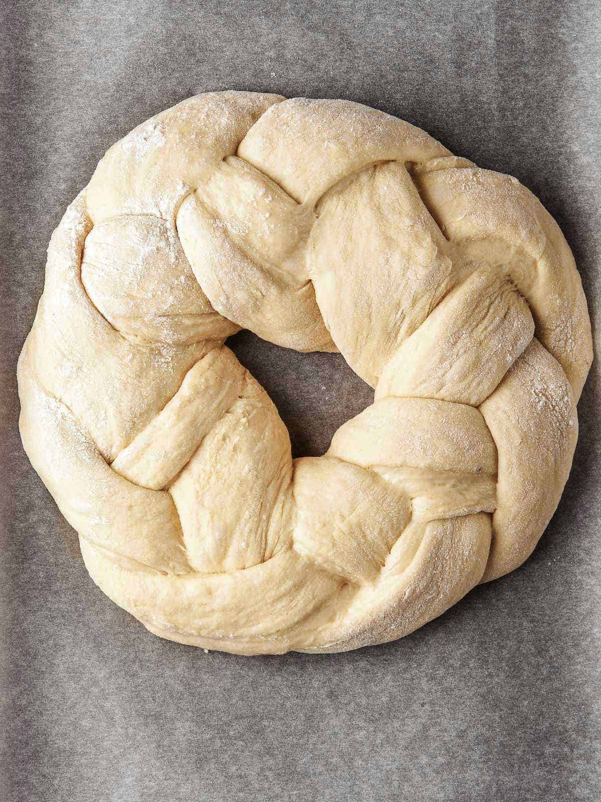 Dough braided into a wreath for a Greek Tsoureki Easter Bread.