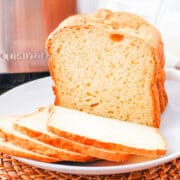 bread machine buttermilk bread sliced on a plate.