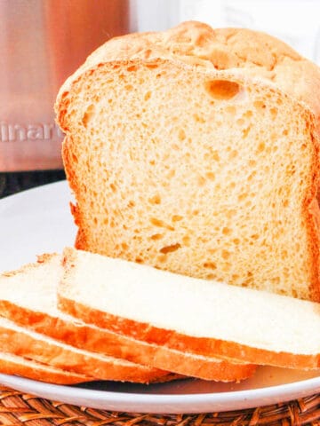 bread machine buttermilk bread sliced on a plate.