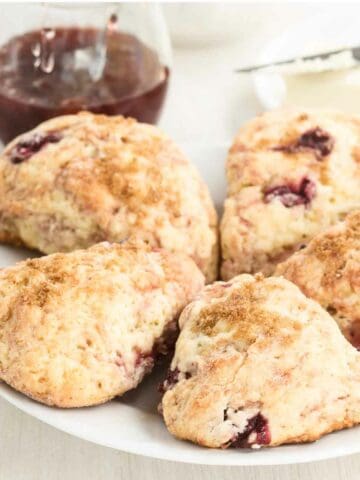 Homemade classic bakery, cream scones with cherry.