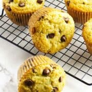 bakery style chocolate chip muffins on a cooling rack.