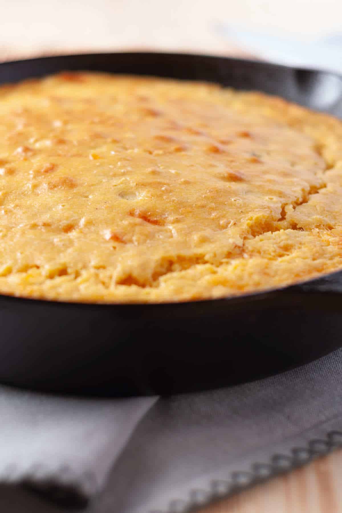 cast iron skillet with baked cornbread.