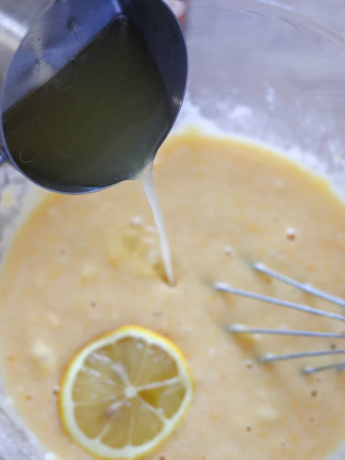 adding lemon juice to batter.