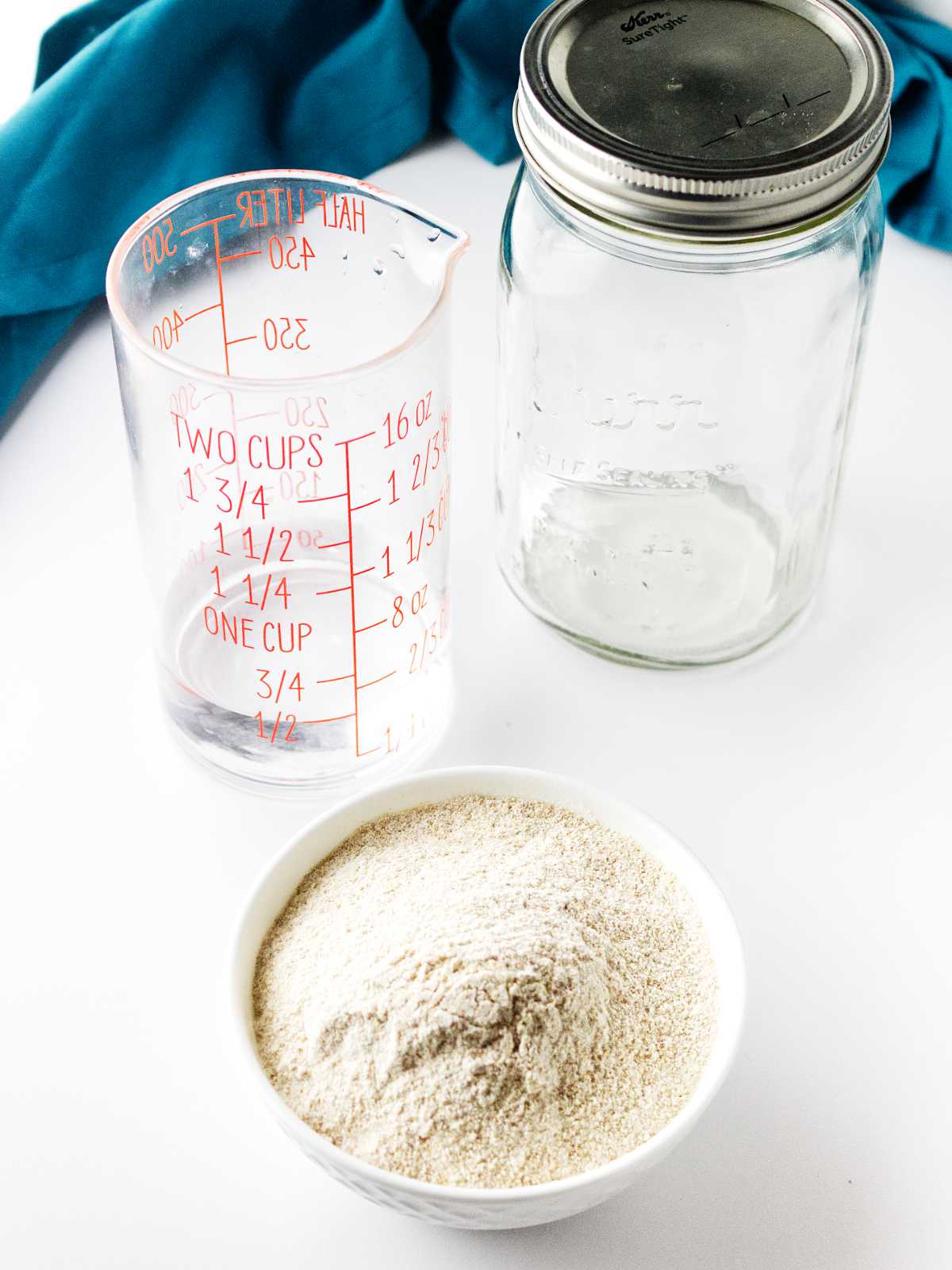 flour, water, and a mason jar to create a sourdough starter.