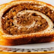 Hungarian Nut Rolls sliced on a plate.