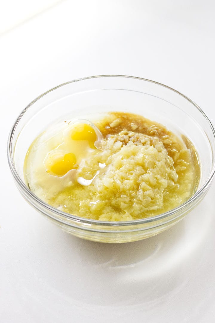 pineapple, eggs, and wet ingredients in a bowl.