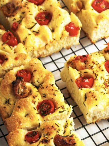 roasted garlic focaccia bread cooling on a wire rack.