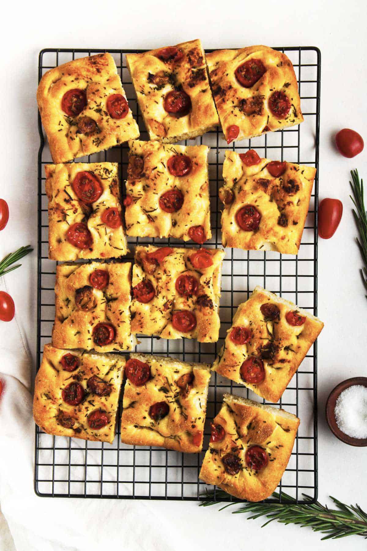 roasted garlic focaccia bread cooling on a wire rack.