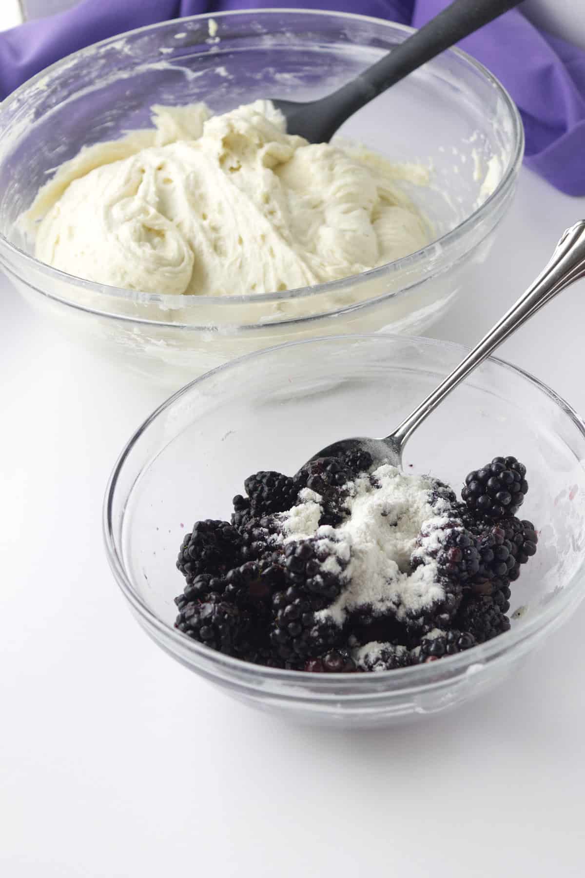 tossing fresh blackberries with flour so they don't sink in the batter.