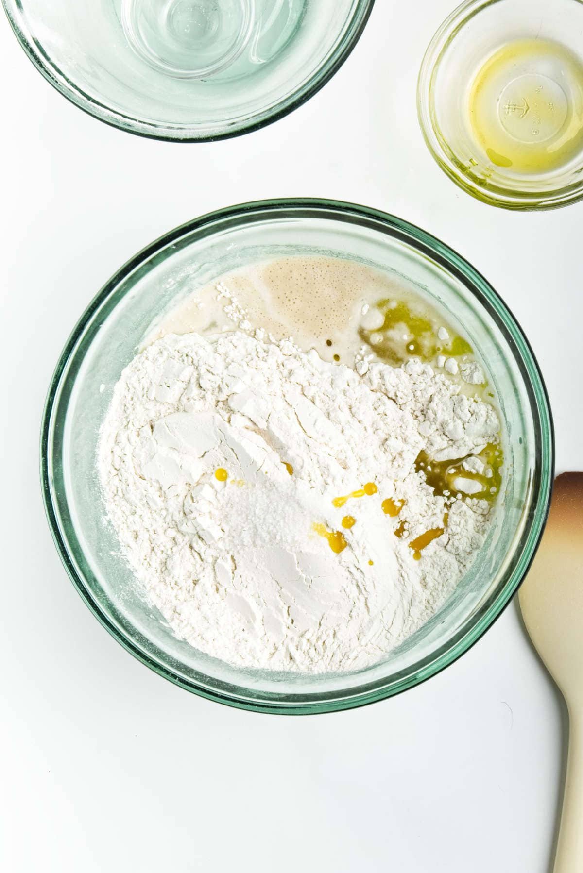 combining wet and dry ingredients to make a dough.