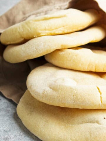 mini pita bread cooling on a towel.