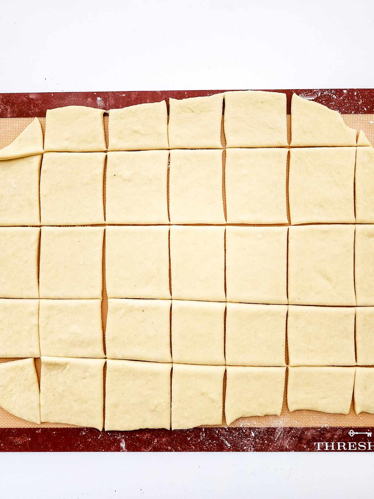 dough cut into beignet squares.