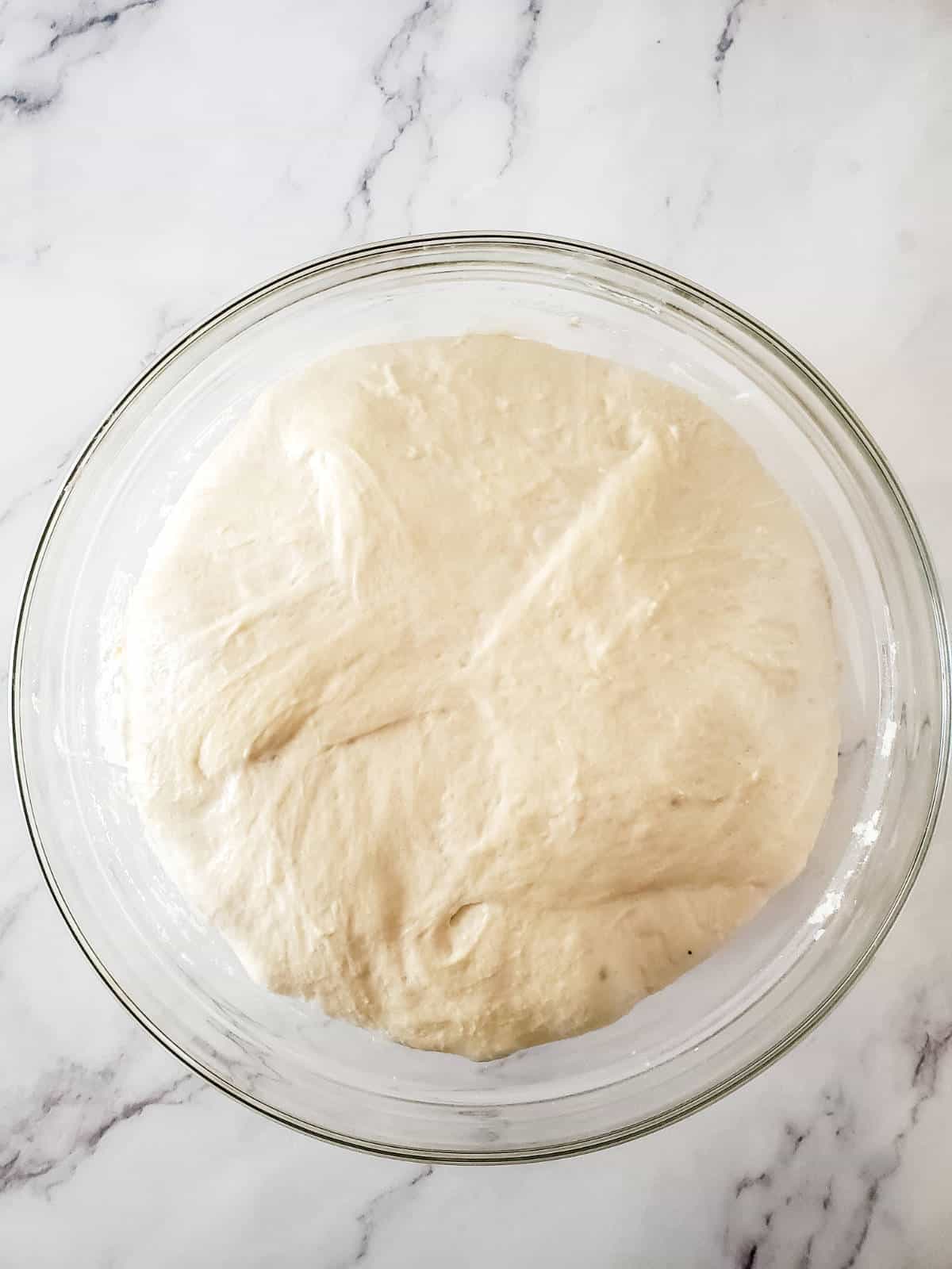 dough in a bowl proofed double.