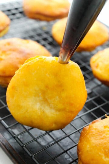 filling paczki with jelly.