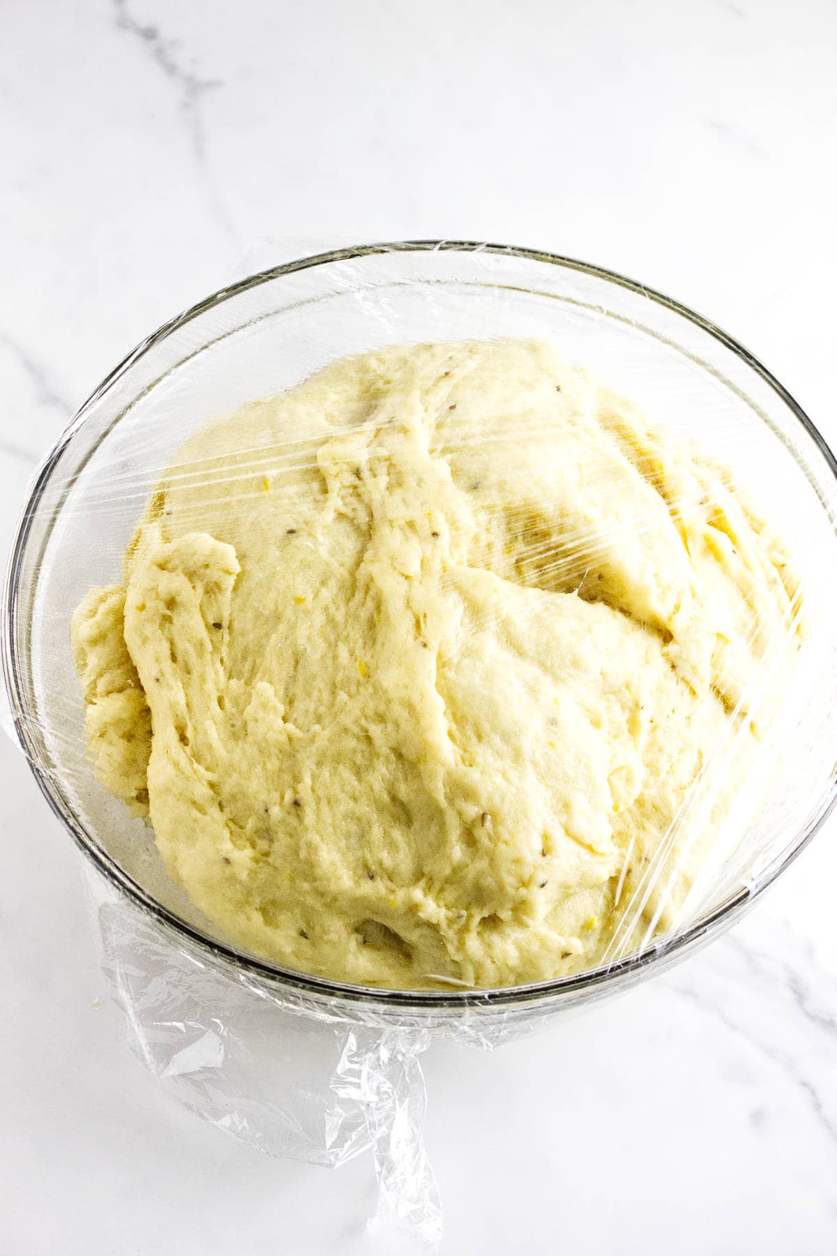 bulk risen dough in a bowl.