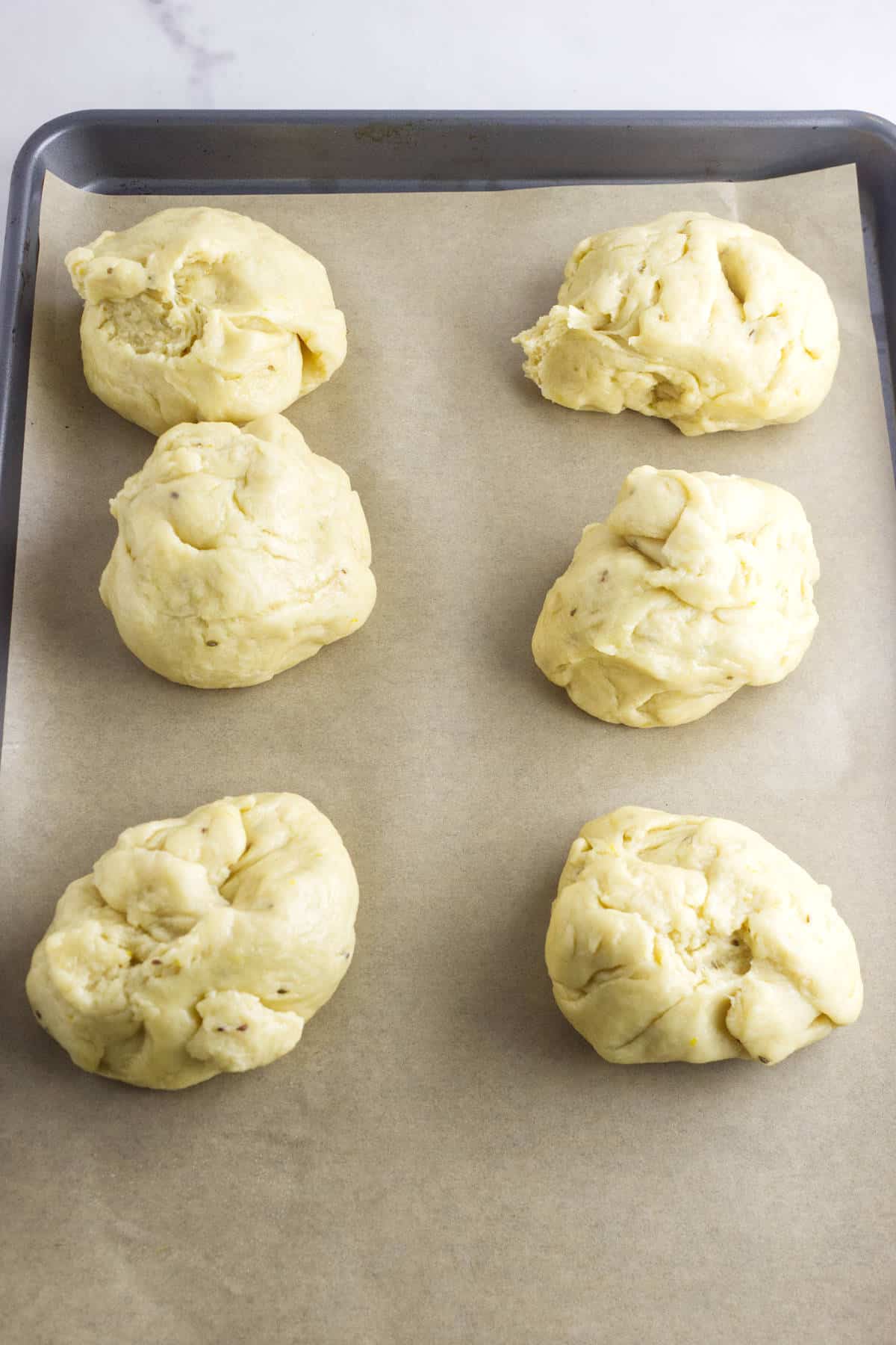 dough divided into 6 smaller balls.