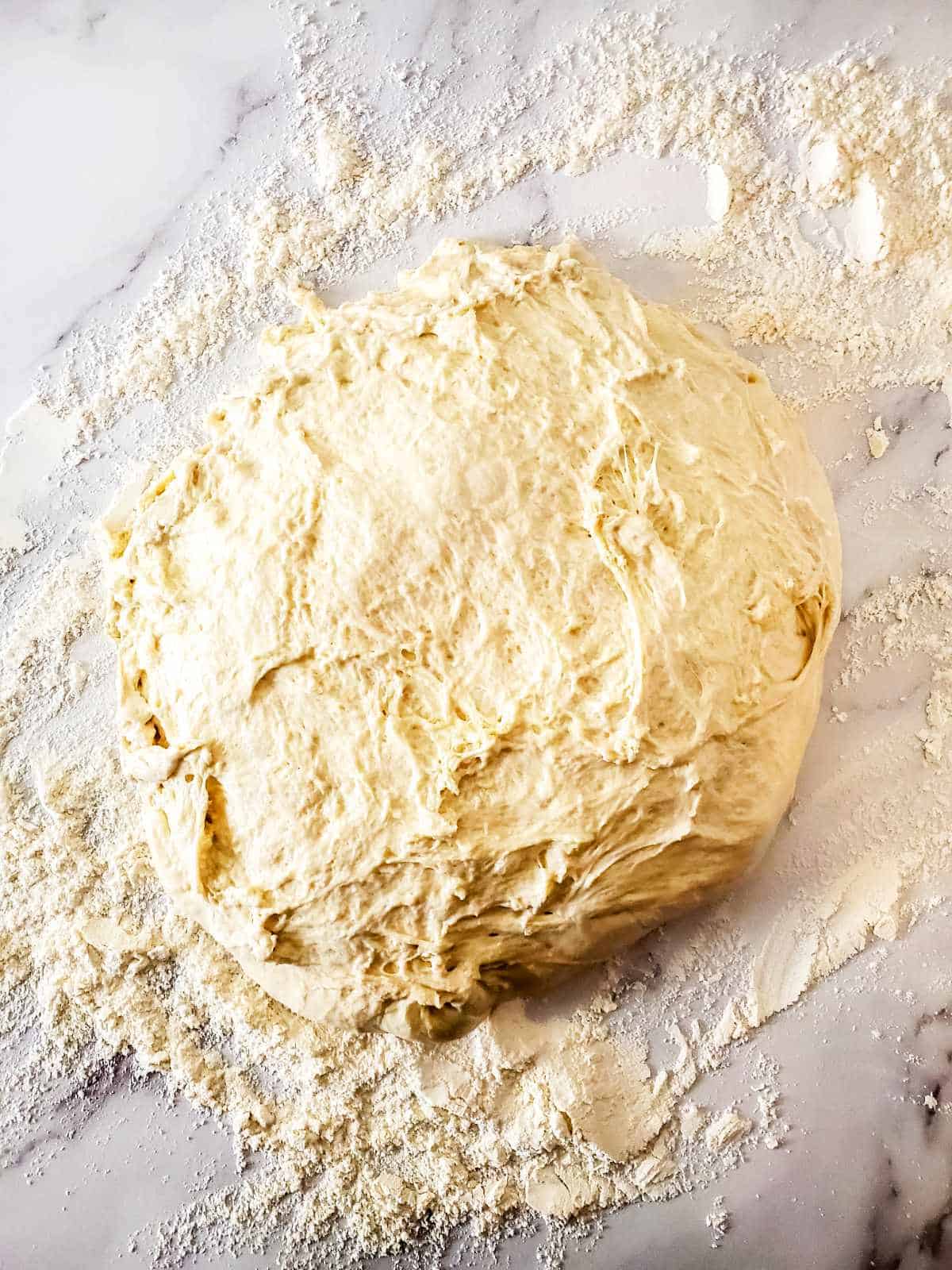 sourdough tipped out onto a floured work surface.