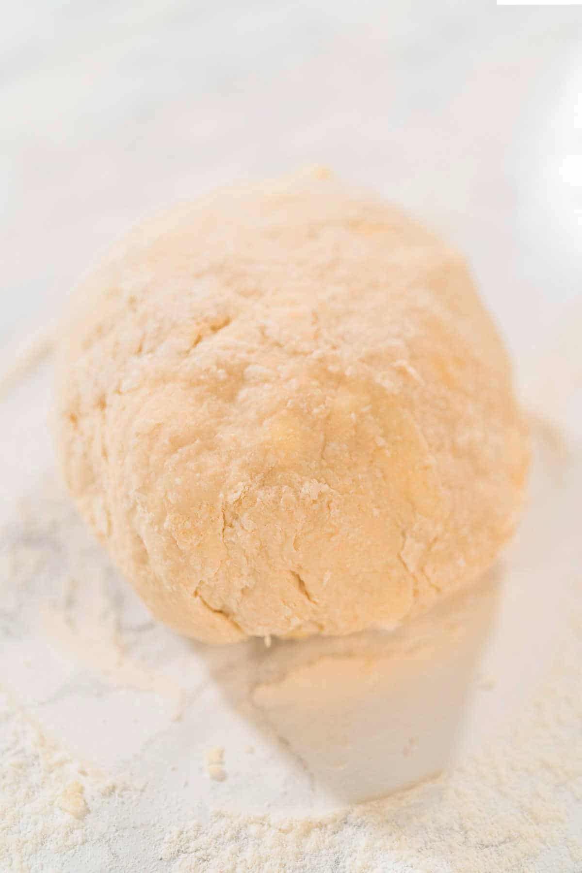 Ball of sourdough discard cinnamon roll dough.