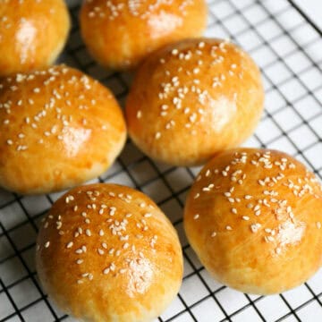 hamburger buns cooling on a rack.