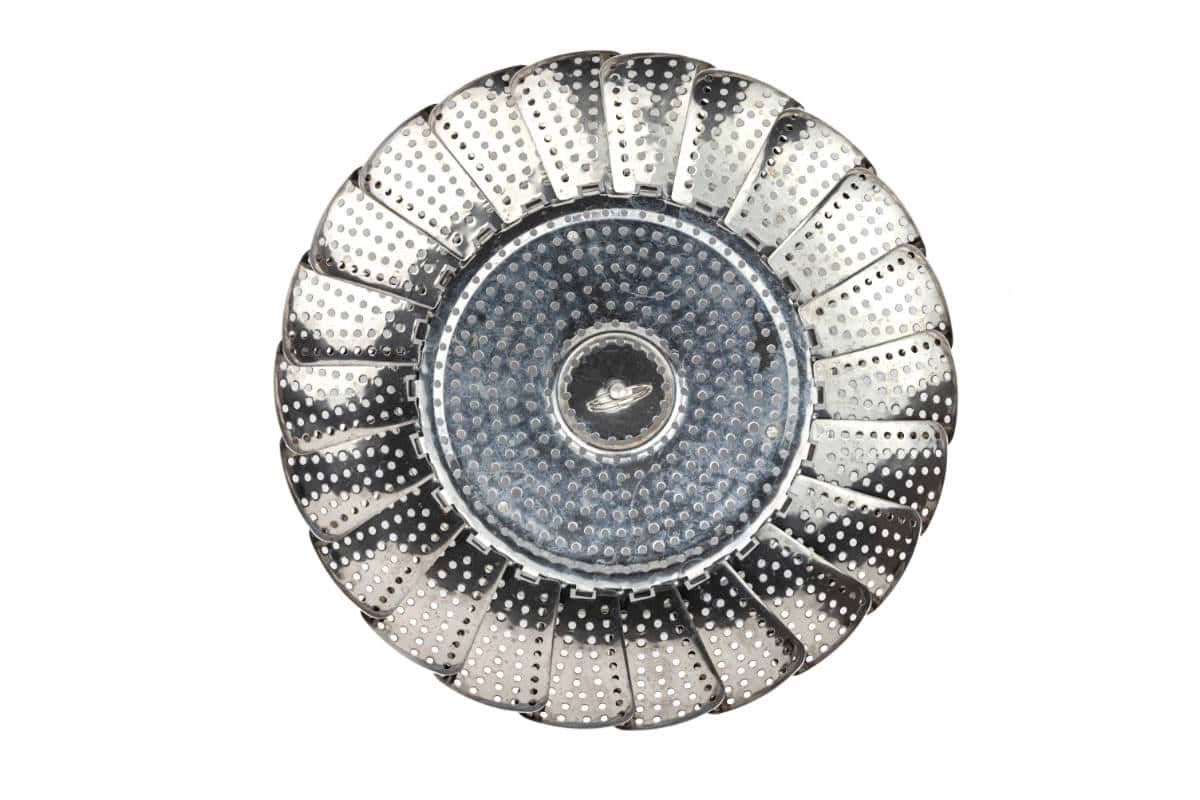 A top-down view of a metal steamer basket with perforated, expandable panels arranged in a circular pattern, perfect for steaming Mantou Buns, isolated on a white background.