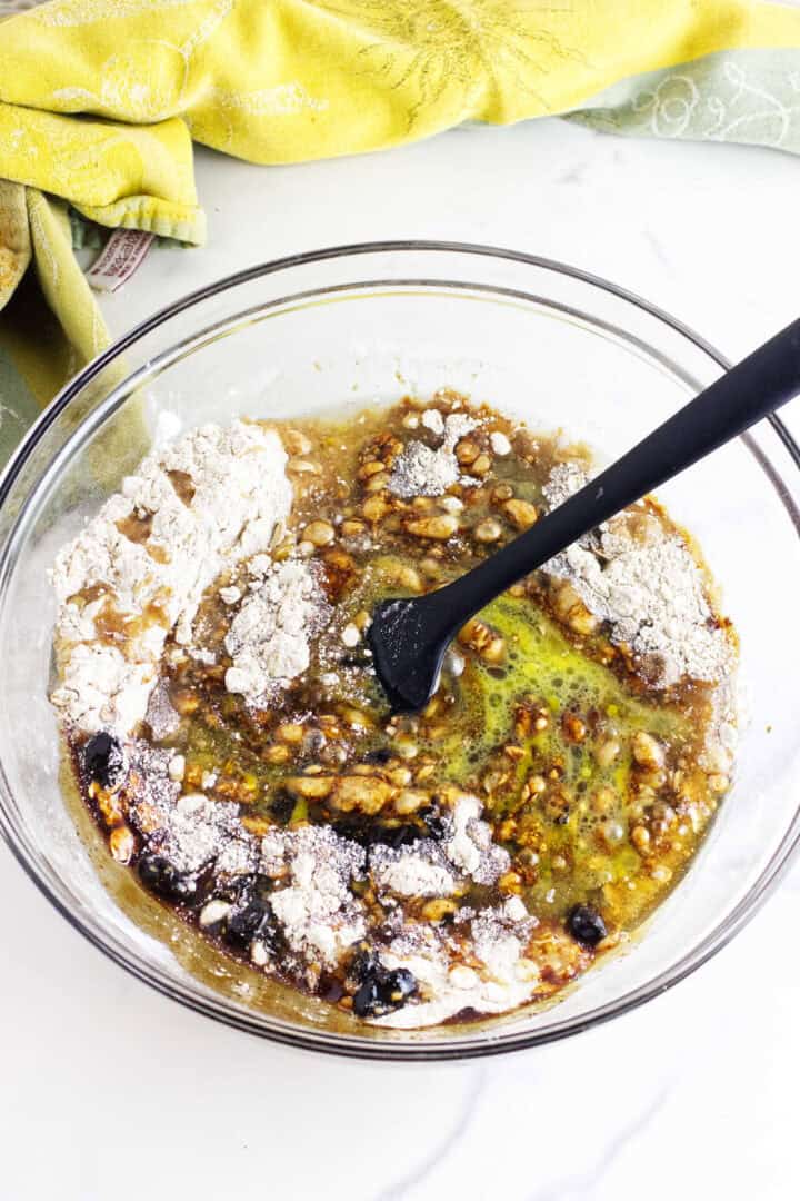 Wet and dry ingredients partially combined in a glass bowl to make Sailor Jack batter.