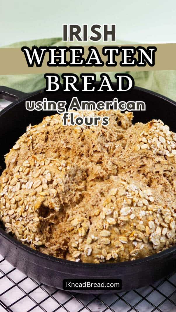 A round loaf of Irish wheaten bread topped with oats sits in a black cast iron pan. Text over the image reads: "Irish Wheaten Bread using American flours.