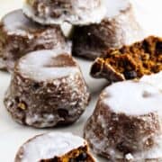 Upside-down Sailor Jack cakes with white glaze setting on a wire rack over a baking sheet.